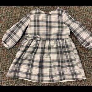 Baby long sleeved flannel dress with bow detail.